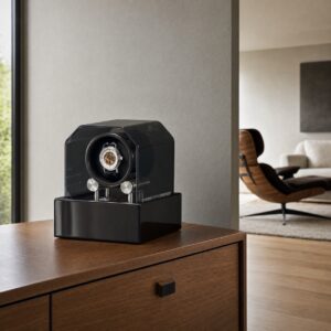Orbita Futura 1 watch winder in black finish displayed on a walnut cabinet